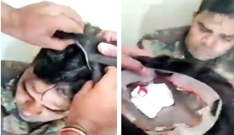 চাকরির পরীক্ষায় নকল করতে পরচুলার ভেতরে ফোন! (ভিডিও)